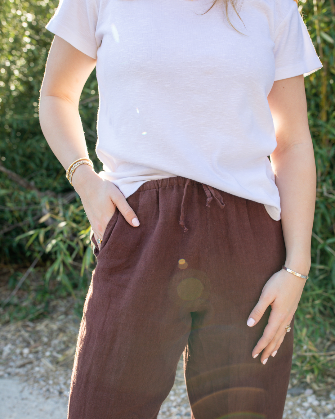 Lightweight white relaxed fit tee styled with brown linen pants