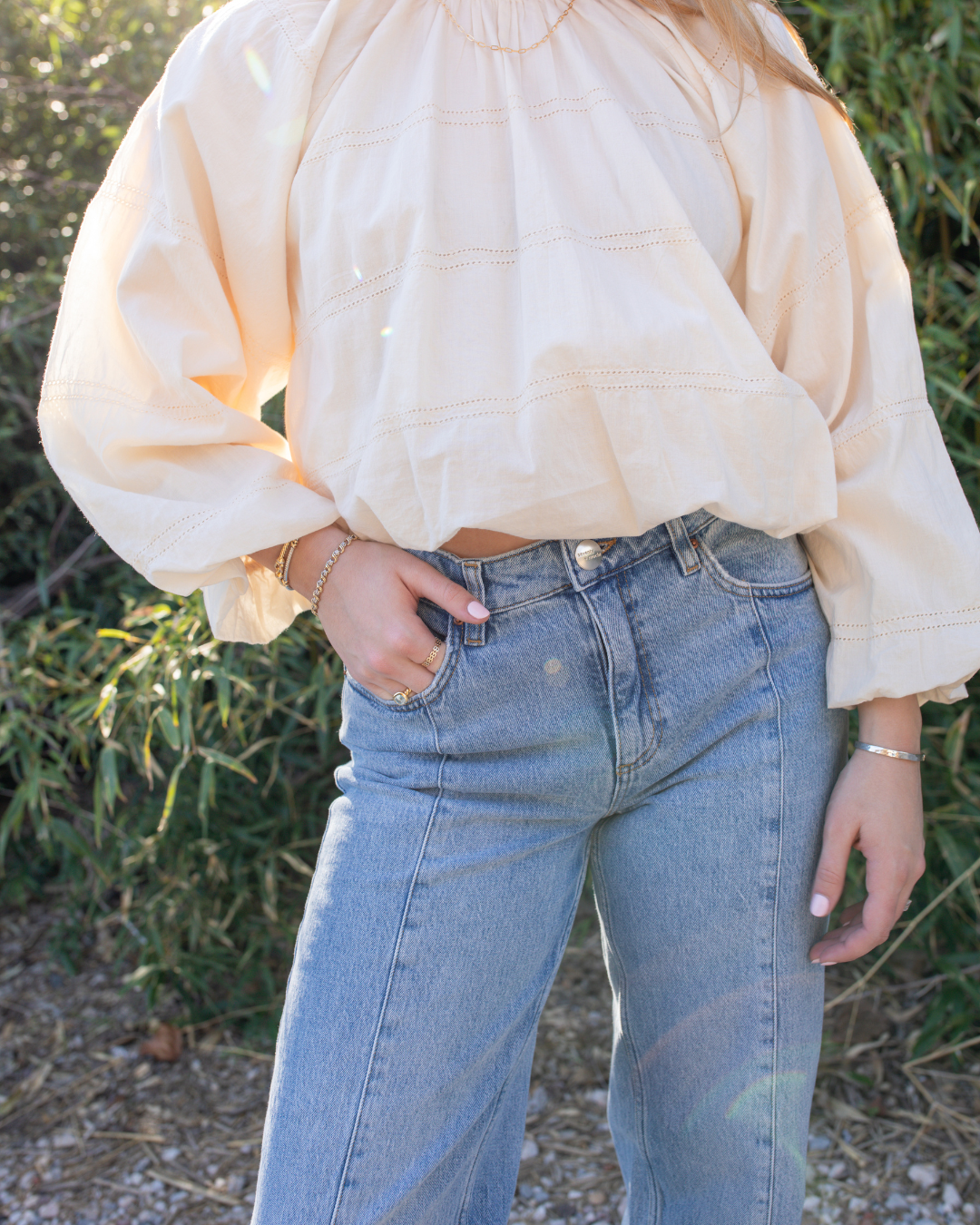 High rise vintage denim styled with neutral blouse