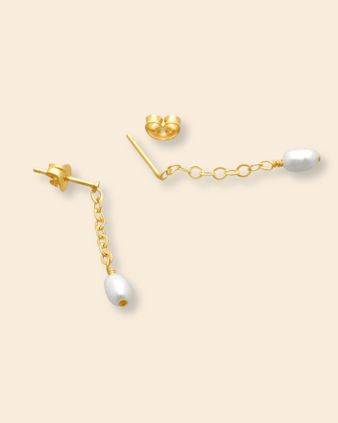 Side view of ABLE Lila Short Pearl Drop Earrings with short gold-filled chain and freshwater pearl detail