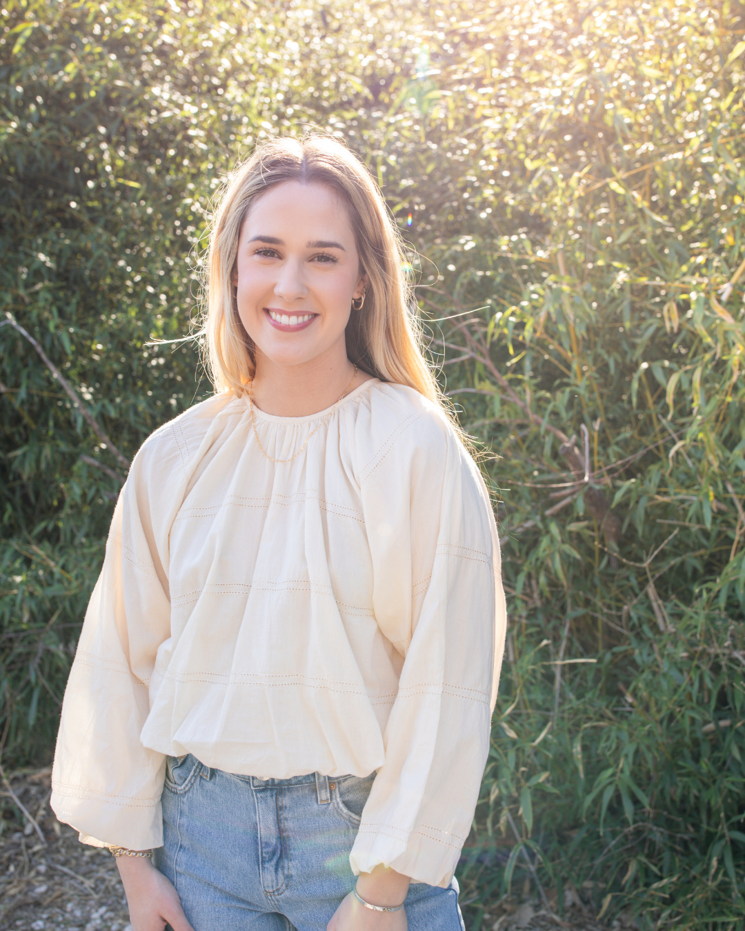 Lightweight cream blouse with voluminous sleeves