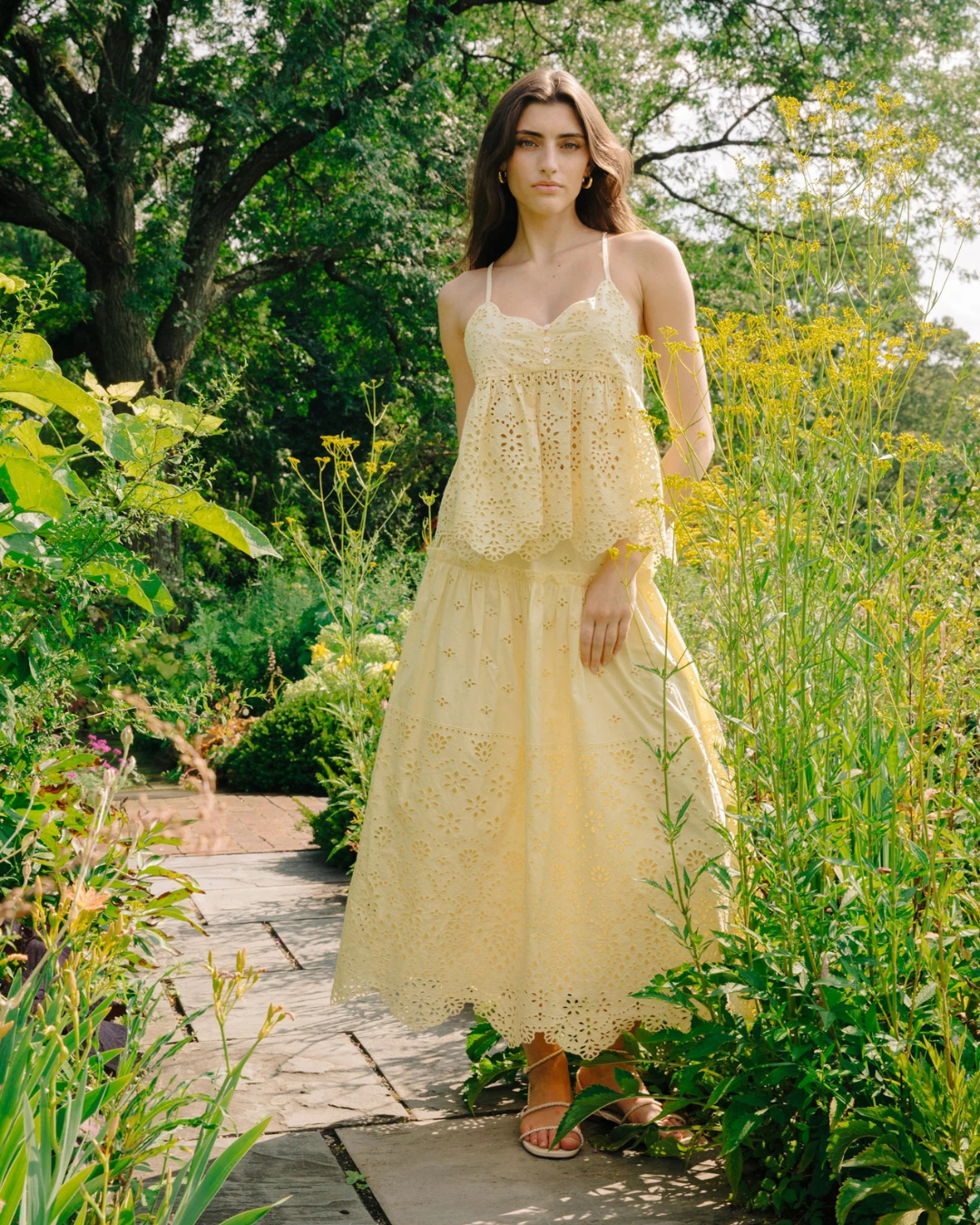 Model wearing Angelique Skirt with matching Zoe Top in garden setting