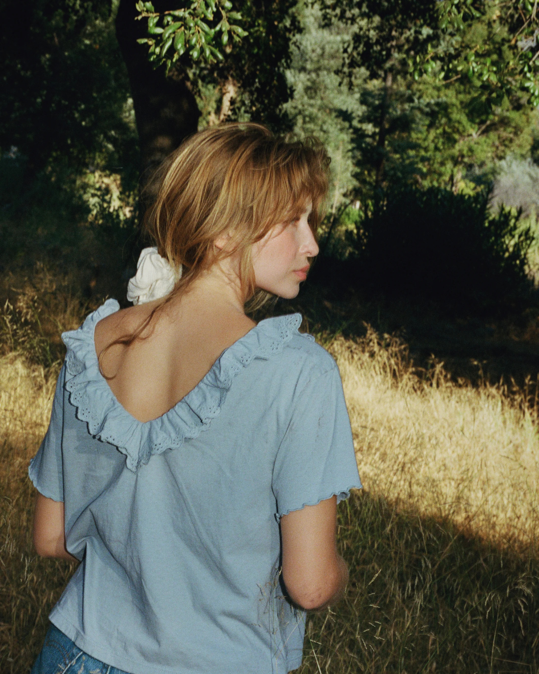  Back view of Cottage Tee Ruffled Collar in Bleu with deep V back and ruffle trim
