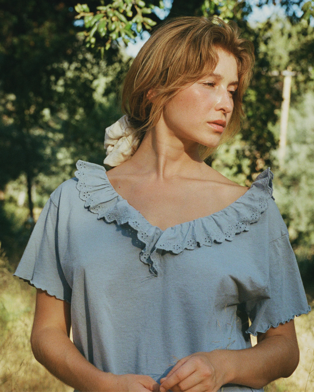 Cottage Tee Ruffled Collar in Bleu front view on model
