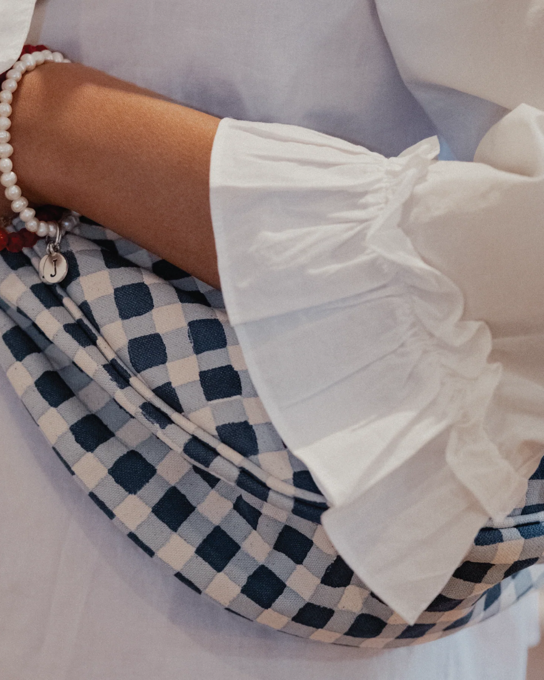 Joyn Moon Sling Bag in Indigo Gingham styled as a hand block printed crossbody bag