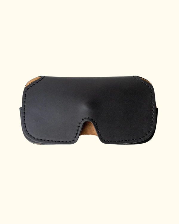 Desert Black full-grain leather sunglasses case with stitched edges and snap closure
