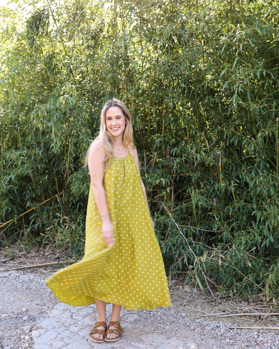 Moss green polka dot midi dress in lightweight linen blend styled with sandals