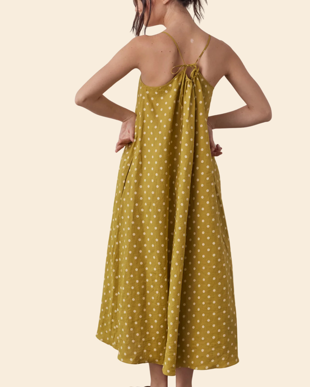Back view of Linen Polka Dot Tie Back Dress in Moss with adjustable tie detail