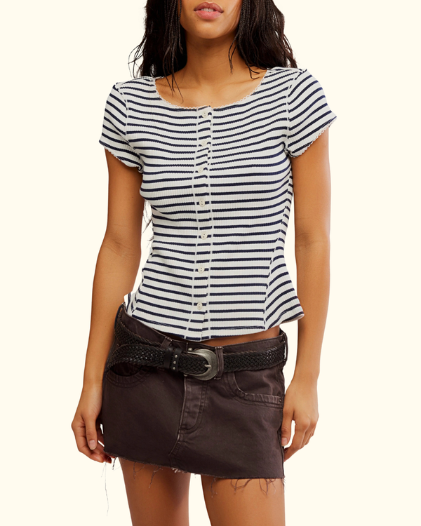 Model wearing Most Wanted Striped Cardi in Black and White with a front button closure and scoop neckline