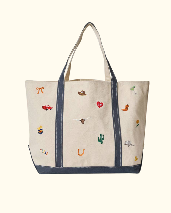 Texas Icons Tote in natural canvas with colorful embroidered Texas details and navy straps