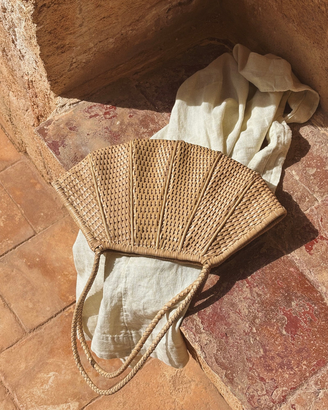 Close up of caramel woven leather Venera Bag with basketweave detail